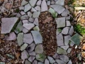 footprint made using found sandstone, c.1ft x 0.5ft, found sandstone